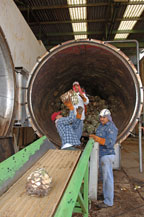 workers load agave pi&ntilde;as into an autoclave at the sangre azteca tequila factory
